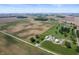 Expansive aerial view of farmland and countryside with farm buildings dotting the landscape at 5396 N 1000 E, Sheridan, IN 46069
