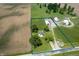 Aerial view of country home with multiple buildings and acreage surrounded by fields at 5396 N 1000 E, Sheridan, IN 46069