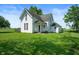 Charming two-story home with a covered porch and lush green lawn at 5396 N 1000 E, Sheridan, IN 46069