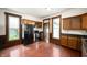 Spacious kitchen with wood cabinets, modern appliances, and hardwood floors at 5396 N 1000 E, Sheridan, IN 46069