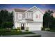 Charming two-story home with a front-facing two car garage and nicely landscaped yard at 5678 Harper Dr, Whitestown, IN 46075