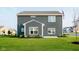 Large backyard with a well-maintained lawn, privacy fence, and nice curb appeal at 588 Arkansas Ln, Westfield, IN 46074