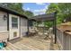 Cozy back deck with seating, awning, and space for relaxing and entertaining outdoors at 618 Shady Creek Dr, Greenwood, IN 46142