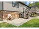 Cozy patio with chairs and table, stairs to the deck, and easy access to the backyard at 618 Shady Creek Dr, Greenwood, IN 46142