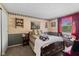 View of the guest bedroom with dark wood furnishings and decorated with a landscape tapestry at 618 Shady Creek Dr, Greenwood, IN 46142