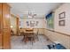 Charming dining area with a ceiling fan and wood-trimmed walls, next to the kitchen at 618 Shady Creek Dr, Greenwood, IN 46142