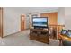 Cozy living room features a TV set on a wooden cabinet near the staircase at 618 Shady Creek Dr, Greenwood, IN 46142