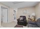 Cozy living room featuring a comfortable leather armchair, ottoman, and wood-paneled walls at 618 Shady Creek Dr, Greenwood, IN 46142