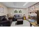 Inviting living room with a brick fireplace, plush seating, and large windows at 618 Shady Creek Dr, Greenwood, IN 46142