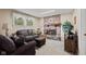 Relaxing living room with a brick fireplace, comfortable seating, and natural light at 618 Shady Creek Dr, Greenwood, IN 46142