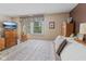 View of the main bedroom featuring a view of the window, a television and warm bedside lighting at 618 Shady Creek Dr, Greenwood, IN 46142