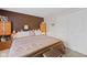 A warm, inviting bedroom featuring a queen-size bed and wooden accents and a pair of white closets at 618 Shady Creek Dr, Greenwood, IN 46142