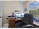Home office area features large windows, neutral walls, and a comfortable chair at 618 Shady Creek Dr, Greenwood, IN 46142