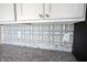 Close-up of stylish decorative tile backsplash, and granite countertop, and light white cabinets with nickel pulls at 6218 N Woodside Ct, McCordsville, IN 46055
