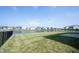 Backyard with iron fence and a serene pond providing a beautiful backdrop at 6218 N Woodside Ct, McCordsville, IN 46055