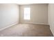 This is a bedroom with carpet flooring, neutral walls, and window at 6218 N Woodside Ct, McCordsville, IN 46055