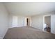This bedroom features neutral walls, carpet flooring, and ensuite bathroom and closet at 6218 N Woodside Ct, McCordsville, IN 46055