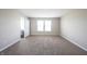 Neutral primary bedroom with soft carpet, lots of light and adjoining bathroom at 6218 N Woodside Ct, McCordsville, IN 46055