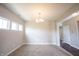 Bright dining room with neutral walls, soft carpet, ample natural light, and a chandelier at 6218 N Woodside Ct, McCordsville, IN 46055