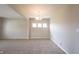 Inviting dining room featuring neutral walls, plush carpeting, a chandelier, and three well-lit windows at 6218 N Woodside Ct, McCordsville, IN 46055