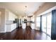 Bright, open kitchen features white cabinets, stainless appliances, and a large island with granite countertops at 6218 N Woodside Ct, McCordsville, IN 46055