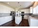 Kitchen with white cabinets, stainless appliances, granite countertops, island and an adjacent pantry at 6218 N Woodside Ct, McCordsville, IN 46055