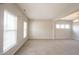 Bright and airy living room with neutral walls, large windows with blinds, and soft carpeting at 6218 N Woodside Ct, McCordsville, IN 46055