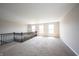 Large carpeted loft with a dark wood railing, and abundant natural light from several windows at 6218 N Woodside Ct, McCordsville, IN 46055