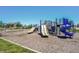 Community playground with swings, slides, and climbing structure with a grass surround at 6218 N Woodside Ct, McCordsville, IN 46055