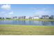 A beautiful serene pond view from a grassy backyard at 6218 N Woodside Ct, McCordsville, IN 46055