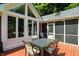 Back deck featuring a gas grill and outdoor table with seating, with large windows into the home at 6316 Harmonridge Ct, Indianapolis, IN 46278