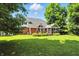 The spacious, well-manicured backyard provides shade and privacy with plenty of room for recreation and relaxation at 6316 Harmonridge Ct, Indianapolis, IN 46278