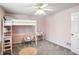 bedroom featuring carpet, a ceiling fan, pink walls, and a loft bed at 6316 Harmonridge Ct, Indianapolis, IN 46278