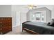 Bedroom featuring carpet, a ceiling fan, a dark wood dresser, and a bed at 6316 Harmonridge Ct, Indianapolis, IN 46278