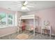 Pink bedroom with carpet, a ceiling fan, a large window, and built-in desk at 6316 Harmonridge Ct, Indianapolis, IN 46278