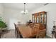 Formal dining room with an eight-seater dining table, a china cabinet, and chandelier at 6316 Harmonridge Ct, Indianapolis, IN 46278