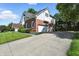 A spacious three car garage and basketball hoop accent the home's exterior at 6316 Harmonridge Ct, Indianapolis, IN 46278