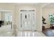 Bright foyer featuring tile flooring, decorative front door, and neutral tones at 6316 Harmonridge Ct, Indianapolis, IN 46278