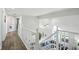 Bright hallway features hardwood floors, fresh paint, and opens to a living area with large windows for plenty of natural light at 6316 Harmonridge Ct, Indianapolis, IN 46278
