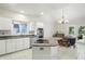 Well-lit kitchen with updated appliances, granite counters, and a breakfast bar that opens to the dining space at 6316 Harmonridge Ct, Indianapolis, IN 46278