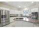 Modern kitchen featuring stainless steel appliances, granite countertops, and ample white cabinets for storage at 6316 Harmonridge Ct, Indianapolis, IN 46278