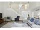 Large open living room featuring staircase to upper floor and views of the entry foyer at 6316 Harmonridge Ct, Indianapolis, IN 46278