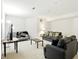 Inviting living room features seating and a Purdue themed throw blanket at 6316 Harmonridge Ct, Indianapolis, IN 46278