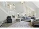 Spacious living room featuring stairs to upper level, hardwood floors and fireplace at 6316 Harmonridge Ct, Indianapolis, IN 46278