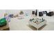 Open playroom with toys, seating, and an easel offers an area for learning and fun at 6316 Harmonridge Ct, Indianapolis, IN 46278