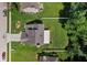 A bird's-eye view of a residential property showcasing the roof and surrounding yard at 6439 Bower Dr, Indianapolis, IN 46241