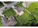 An aerial view of a home featuring a well-manicured lawn and a white picket fence at 6439 Bower Dr, Indianapolis, IN 46241