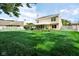 Expansive backyard featuring a screened-in porch, lush lawn, and a charming white picket fence at 6439 Bower Dr, Indianapolis, IN 46241
