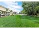 Lush green backyard with a white picket fence enclosing the property, offering privacy and space at 6439 Bower Dr, Indianapolis, IN 46241