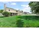 A manicured lawn and enclosed patio highlight the home's spacious backyard at 6439 Bower Dr, Indianapolis, IN 46241